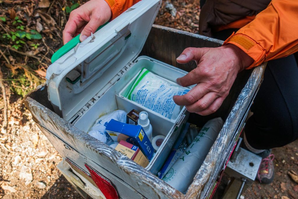 Picture of an Emergency Kit with a person reaching into it Picture of an Emergency Kit with a person reaching into it